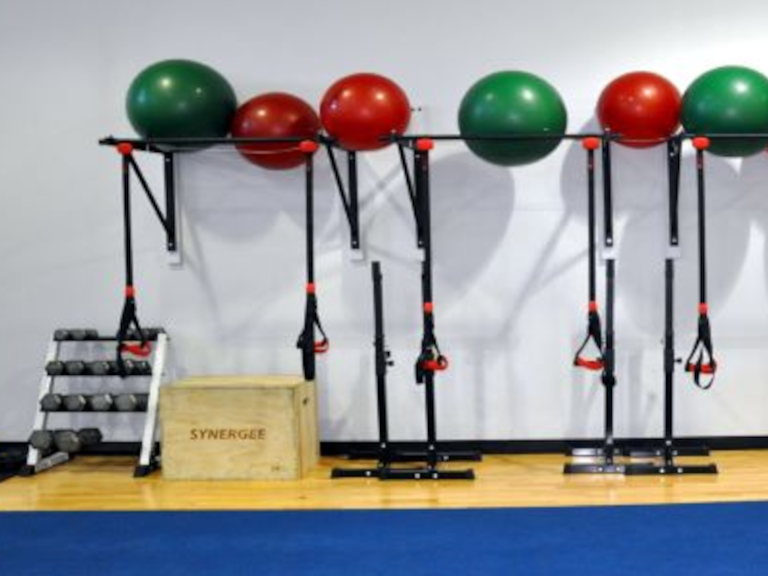 a wall of weights and exercise equipment
